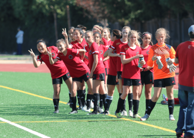 Red Star Soccer Girls team on sideline